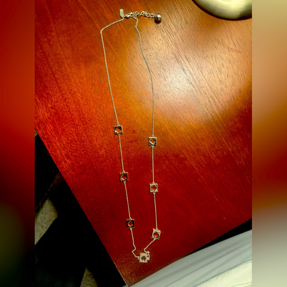 Like new Kate Spade cutout silver plated necklace; beautiful; perfect gift!